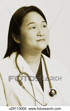 Close-up of a female doctor with a stethoscope around her neck View Large Photo Image Stock Photography - Close-up of a female doctor with a stethoscope around her neck. Fotosearch