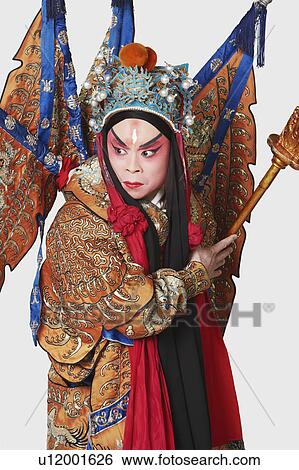 Close-up of a male Chinese opera performer holding a weapon View Large Photo Image Stock Photograph - Close-up of a male Chinese opera performer holding a weapon. Fotosearch
