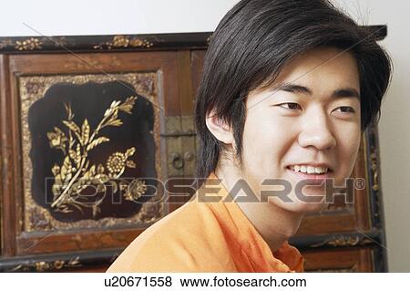 Stock Photo - Close-up of a young man smiling. Fotosearch
