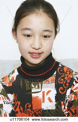Picture - Close-up of a young woman looking down. Fotosearch