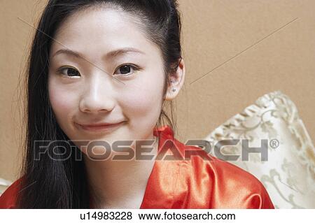 Stock Photo - Close-up of a young woman smiling. Fotosearch
