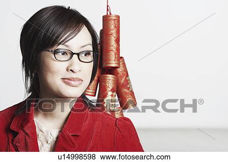 Close-up of a young woman smiling View Large Photo Image Stock Photo - Close-up of a young woman smiling. Fotosearch