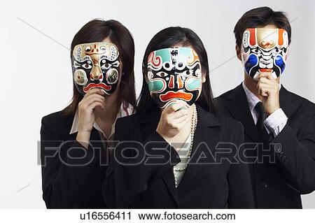 Close-up of two businesswomen and a businessman wearing masks View Large Photo Image Stock Image - Close-up of two businesswomen and a businessman wearing masks. Fotosearch