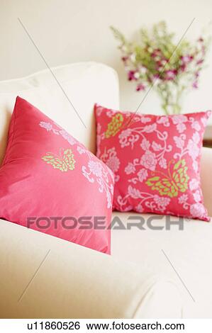 Stock Photograph - Close-up of two cushions on an armchair. Fotosearch