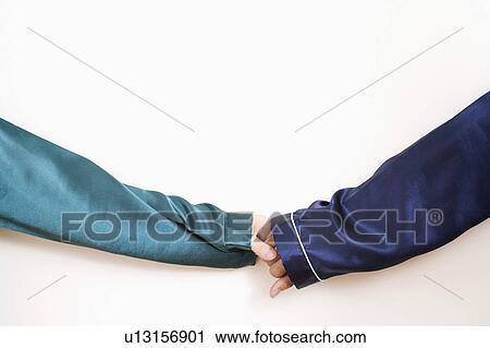Close-up of two people's hands holding each other View Large Photo Image Stock Image - Close-up of two people's hands holding each other. Fotosearch