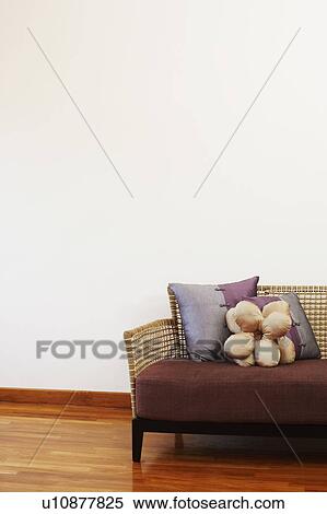 Stock Photography - Couch on a hardwood floor. Fotosearch