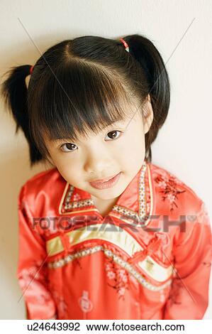Stock Image - High angle view of a girl wearing traditional clothing. Fotosearch