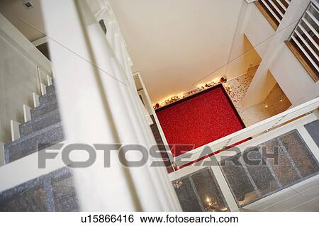 Stock Photograph - High angle view of a hot tub covered with rose petals. Fotosearch