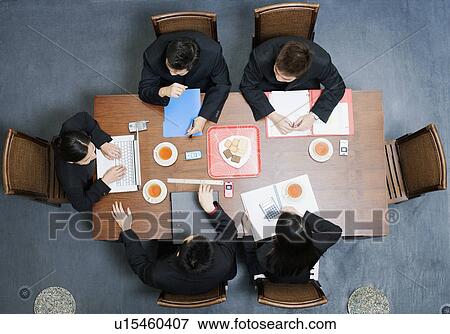 High angle view of five business executives in a meeting View Large Photo Image Stock Photo - High angle view of five business executives in a meeting. Fotosearch