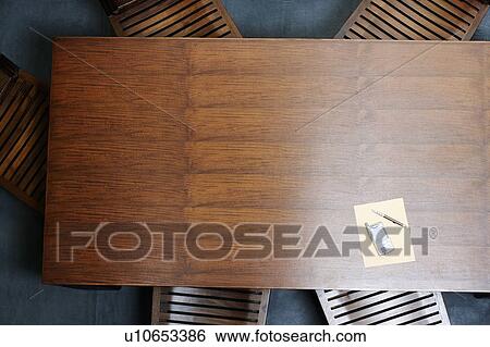 Mobile phone on the table with a notepad and a pen View Large Photo Image Stock Photograph - Mobile phone on the table with a notepad and a pen. Fotosearch