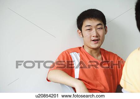 Stock Image - Portrait of a boy smiling. Fotosearch