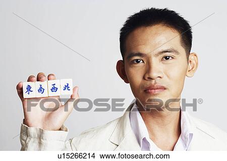Portrait of a businessman holding marble cubes View Large Photo Image Picture - Portrait of a businessman holding marble cubes. Fotosearch