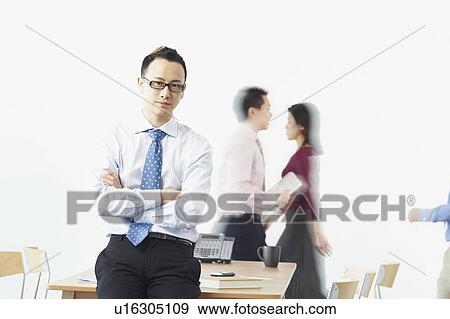 Stock Photo - Portrait of a businessman looking serious. Fotosearch