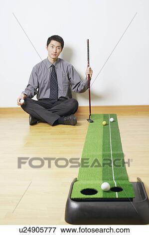 Portrait of a businessman sitting on the floor View Large Photo Image Stock Photo - Portrait of a businessman sitting on the floor. Fotosearch