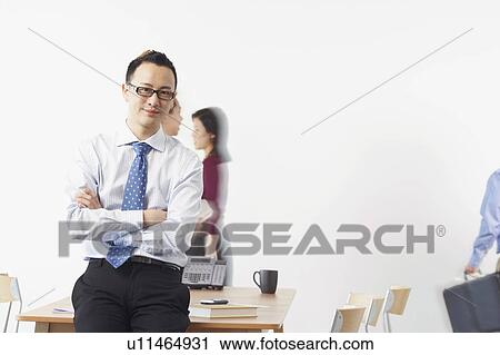 Stock Image - Portrait of a businessman smiling. Fotosearch