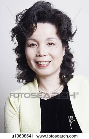 Stock Image - Portrait of a businesswoman smiling. Fotosearch