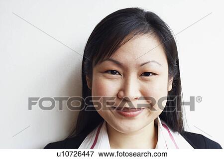 Stock Photo - Portrait of a businesswoman smiling. Fotosearch