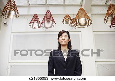 Portrait of a businesswoman standing View Large Photo Image Stock Image - Portrait of a businesswoman standing. Fotosearch