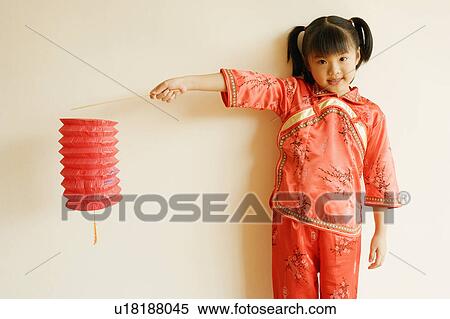 Portrait of a child holding a Chinese lantern View Large Photo Image Stock Photography - Portrait of a child holding a Chinese lantern. Fotosearch