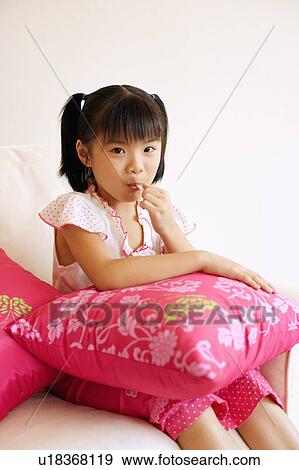 Portrait of a girl eating a lollipop View Large Photo Image Stock Photo - Portrait of a girl eating a lollipop. Fotosearch