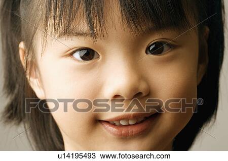 Stock Image - Portrait of a girl smiling. Fotosearch