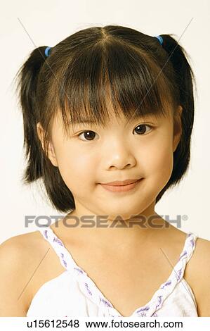 Stock Photo - Portrait of a girl smiling. Fotosearch
