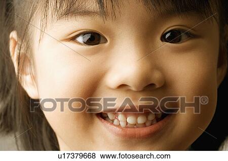 Portrait of a girl smiling View Large Photo Image Stock Photo - Portrait of a girl smiling. Fotosearch