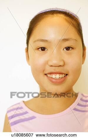 Stock Photo - Portrait of a girl smiling. Fotosearch