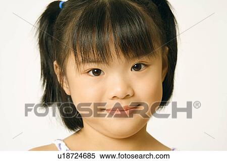 Stock Photography - Portrait of a girl smiling. Fotosearch