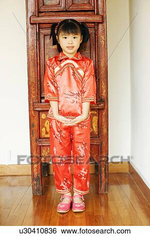 Stock Photograph - Portrait of a girl standing. Fotosearch