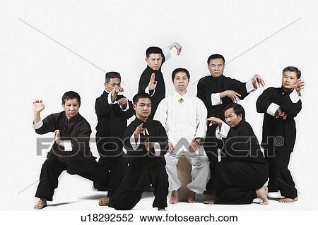 Stock Image - Portrait of a group of people practicing martial arts. Fotosearch
