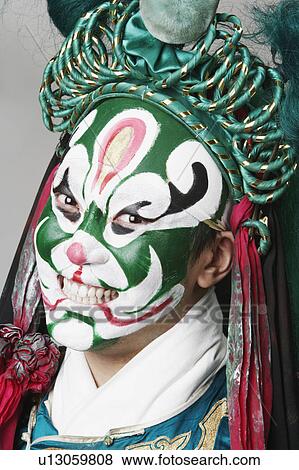 Portrait of a male Chinese opera performer clenching his teeth View Large Photo Image Stock Photo - Portrait of a male Chinese opera performer clenching his teeth. Fotosearch