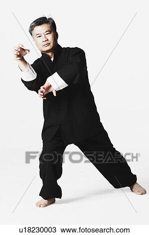 Stock Image - Portrait of a mature man practicing martial arts. Fotosearch