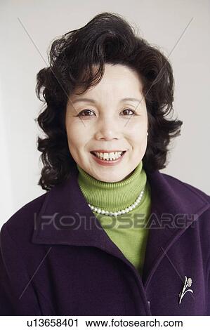 Stock Image - Portrait of a mature woman smiling. Fotosearch