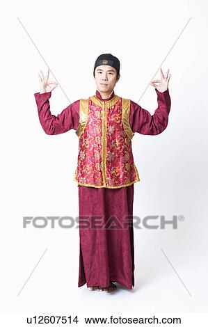 Picture - Portrait of a mid adult man making an ok sign with his hands. Fotosearch