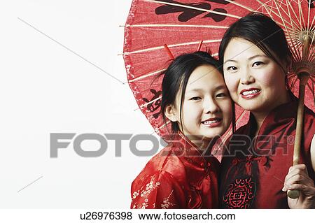 Portrait of a mother and her daughter smiling View Large Photo Image Stock Photo - Portrait of a mother and her daughter smiling. Fotosearch