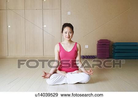 Stock Photo - Portrait of a teenage girl meditating. Fotosearch