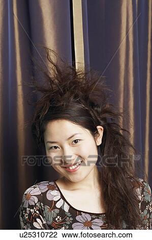 Stock Image - Portrait of a teenage girl smiling. Fotosearch