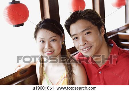 Portrait of a young couple smiling View Large Photo Image Stock Image - Portrait of a young couple smiling. Fotosearch