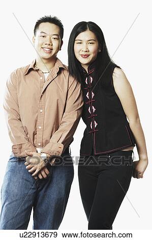 Portrait of a young couple smiling View Large Photo Image Stock Photo - Portrait of a young couple smiling. Fotosearch