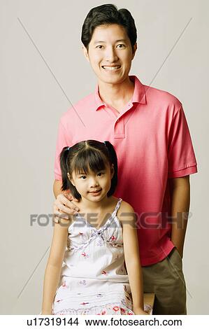 Picture - Portrait of a young man and his daughter. Fotosearch