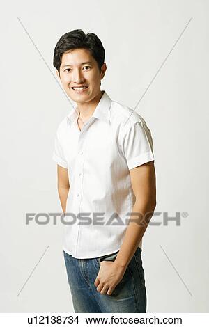 Picture - Portrait of a young man smiling. Fotosearch