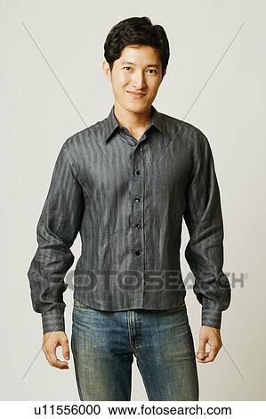 Stock Image - Portrait of a young man smiling. Fotosearch