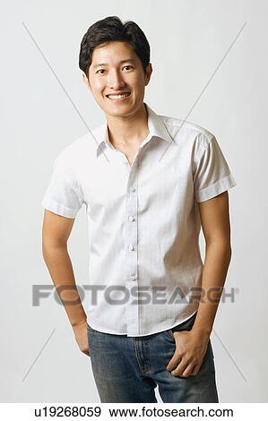 Portrait of a young man smiling View Large Photo Image Stock Photo - Portrait of a young man smiling. Fotosearch