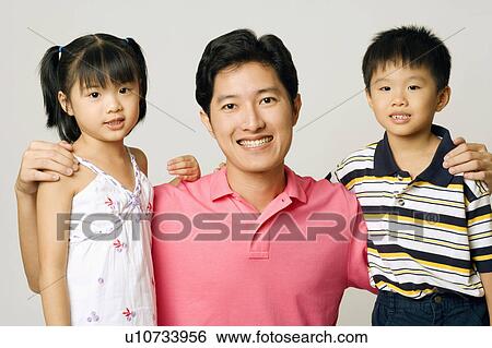 Portrait of a young man with his son and daughter View Large Photo Image Stock Photograph - Portrait of a young man with his son and daughter. Fotosearch