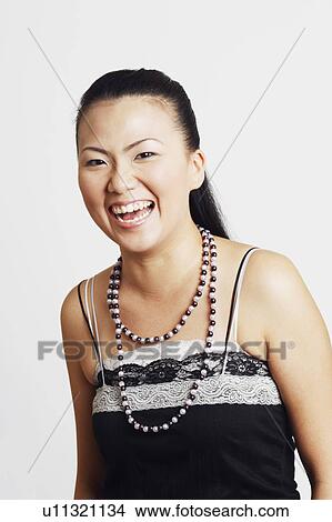 Portrait of a young woman laughing View Large Photo Image Picture - Portrait of a young woman laughing. Fotosearch