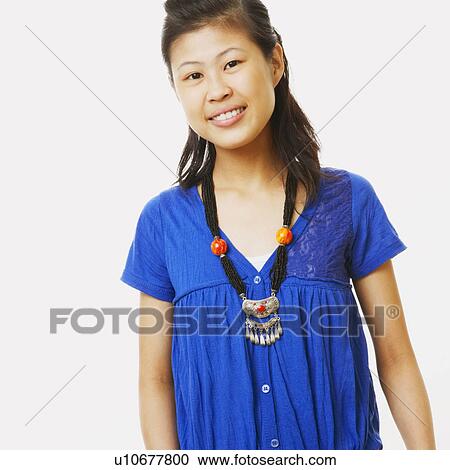 Stock Image - Portrait of a young woman smiling. Fotosearch
