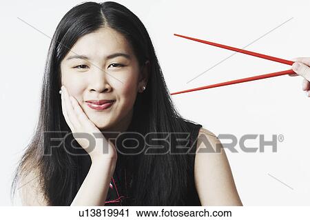 Portrait of a young woman smiling View Large Photo Image Stock Image - Portrait of a young woman smiling. Fotosearch