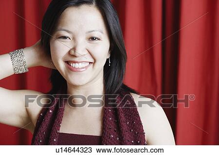 Portrait of a young woman smiling View Large Photo Image Stock Image - Portrait of a young woman smiling. Fotosearch