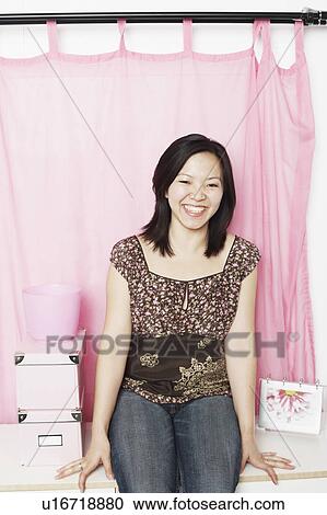 Portrait of a young woman smiling View Large Photo Image Stock Image - Portrait of a young woman smiling. Fotosearch